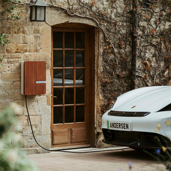 Andersen home EV charge point charging an electric car on a driveway